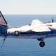 Grumman C-1A Trader approaching the U.S. aircraft carrier USS Constellation (CVA-64) ca. 1974 (US Navy)